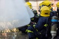 Firefighters team spray water to extinguishes a fire Royalty Free Stock Photo