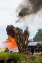 Firefighters train near the stump.