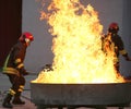 Firefighters during a training exercise off a fire in the brazie Royalty Free Stock Photo