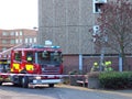 Firefighters using ladder at a fire.