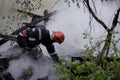 Firefighters using water hoses to extinguish a fire