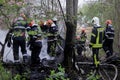 Firefighters using water hoses to extinguish a fire