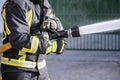 Firefighters who use fire extinguishers and hose water to fight fires