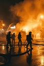 911. Firefighters at work against the backdrop of a raging flame. Strength in Unity Royalty Free Stock Photo