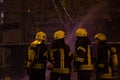 Firefighters at work. extinguishing fire water in the winter night. fire tower, fire hose. Kiev, January 20, 2018