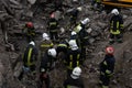 Firefighters work on the rescue of bodies in a building destroyed by a Russian shell,