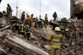 Firefighters work on the rescue of bodies in a building destroyed by a Russian shell