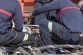 Firefighters working with a suction pump