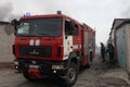 firefighters working to put out the fire caused by a Russian missile in a warehouse in Kharviv