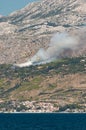 Firefighting airplanes putting out fire above coastal town in Croatia