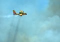 A firefighting Canadair CL-215 aircraft operates in Hymettus mount wildfire.