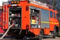 Firefighting vehicle with hose