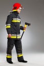 Fireman with axe, side view. Royalty Free Stock Photo