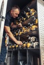 Fireman checking fire extinguisher in truck