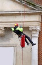 Fireman climbing with ropes and climbing equipment to monitoring