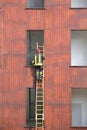 Fireman climbs up the ladder during a training Royalty Free Stock Photo