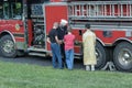 Fireman demonstrates equipment on firetruck just blessed