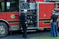 Fireman demonstrates equipment on firetruck just blessed