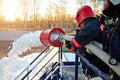 Fireman extinguish fire by foam spraying hose