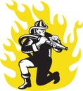 Fireman firefighter kneel aim fire hose Royalty Free Stock Photo