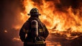 Fireman or firefighter putting out a huge fire and flame Royalty Free Stock Photo