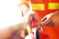 Fireman hand holding fire extinguisher Royalty Free Stock Photo