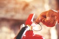 Fireman hand holding fire extinguisher. Royalty Free Stock Photo
