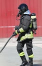 fireman with hardhat and oxygen cylinder with respirator