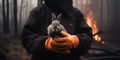 Fireman Holding Wild Rabbit During Fire In Forest