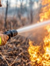 a fireman hosing flames with a firehose Royalty Free Stock Photo