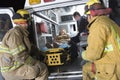 Fireman Looking At Patient And EMT Doctor Royalty Free Stock Photo