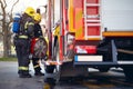 Fireman  pack equipment on the fire truck.firefighter  successfully completed the firefighting Royalty Free Stock Photo