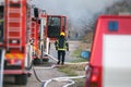 fireman rescuing a burning house