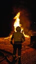 fireman saving a fire with the hose on the ground