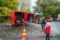 Fireman teaching child to extinguish fire