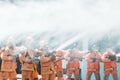 Fireman using water and extinguisher to fighting with fire flame