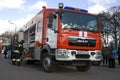 Fireman walks by machine. Photo take in Moscow