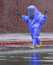 fireman wears a special suit to extinguish a fire caused by tox