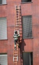 Fireman on the wooden ladder