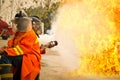 Firemen in action fighting fire during training Royalty Free Stock Photo