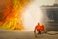 Firemen in action fighting fire during training Royalty Free Stock Photo