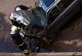 Firemen checking crashed car