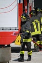 Firemen extinguish a simulated fire