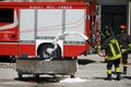 Firemen extinguish a simulated fire