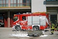 Firemen extinguish a simulated fire during an exercise in their