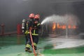 Firemen fighting the fire