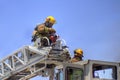Firemen On A Ladder Truck