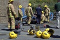 Firemen practice cutting an injured driver out of a wrecked car