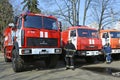 Firemen standing near fire trucks before training. Kyivska oblast, Ukraine