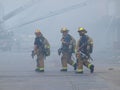 Firemen take hydration break from heat and smoke